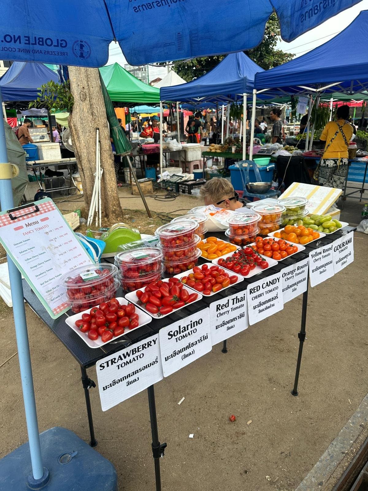 Veggies To Go produce displayed in branded clamshell packs at the market